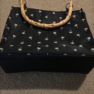 Elegant Black Tote with Palm Print and Bamboo Handle